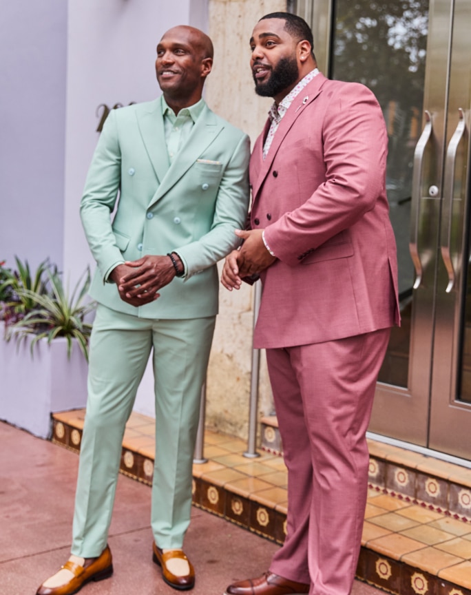 Two men in pastel double-breasted suits