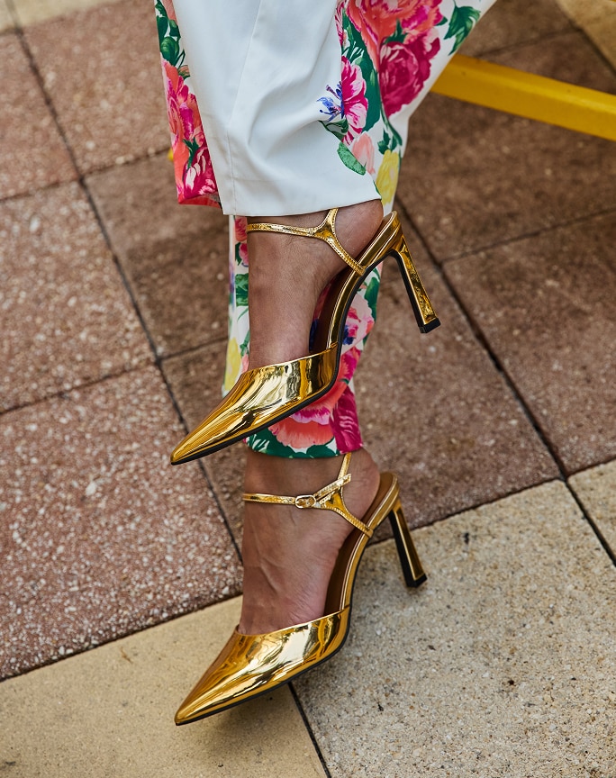 Gold heels and floral print trousers
